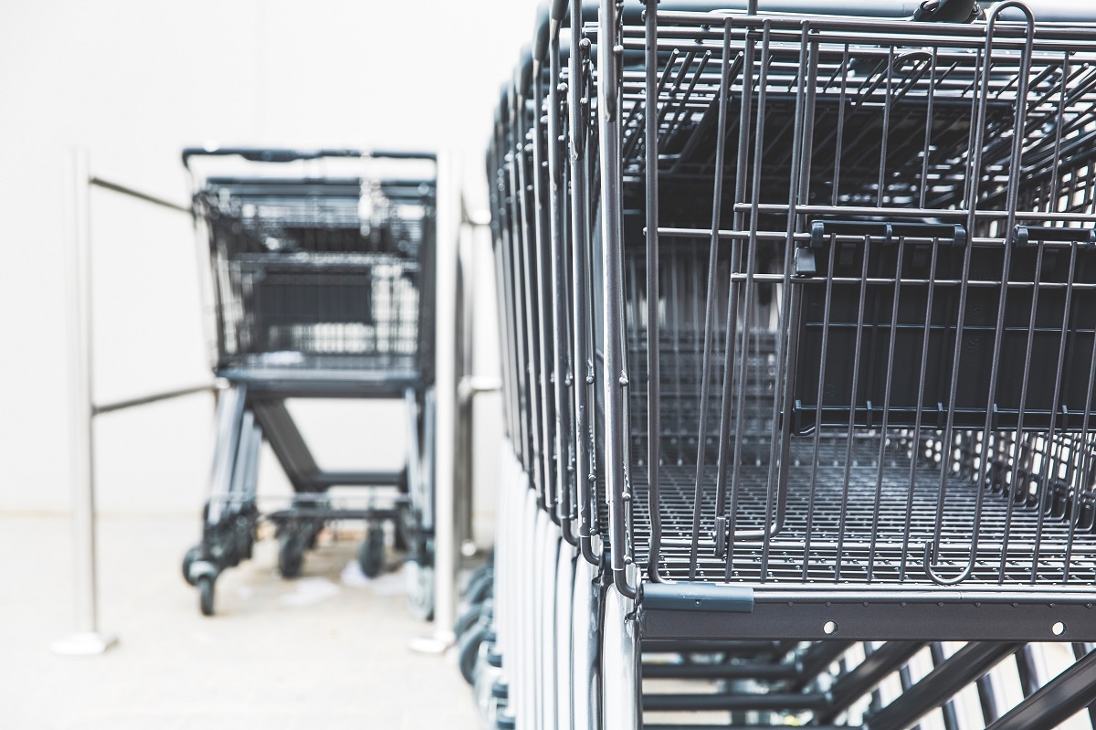 The image shows two shopping carts that symbolize the Amazon BuyBox,