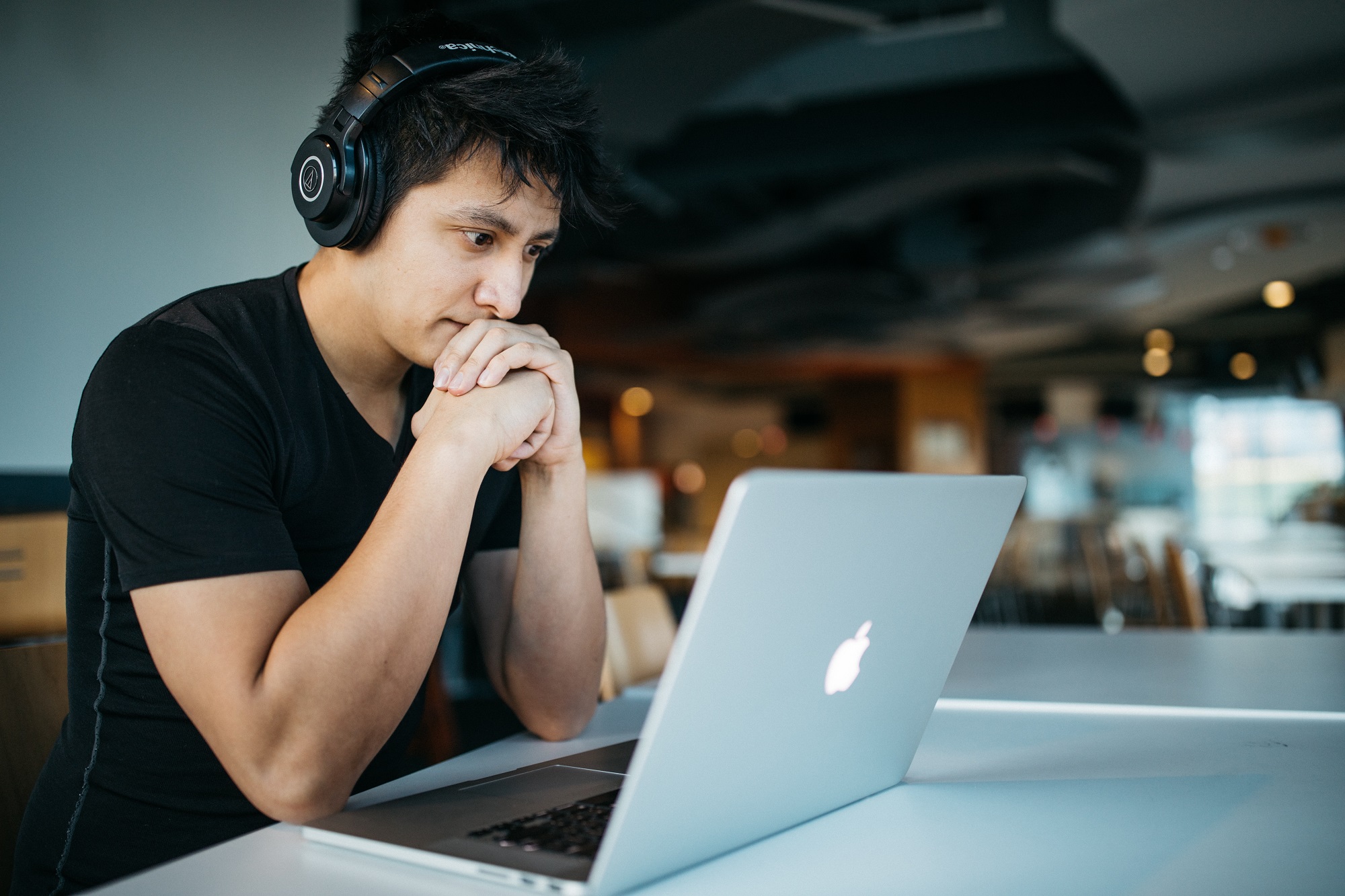 Young man sitting in front of a laptop