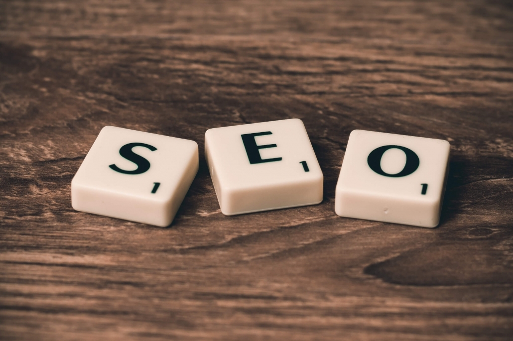 The picture shows white tiles with letters that form the word SEO. SEO stands for Search Engine Optimization, which is also operated in the form of Amazon SEO on the Amazon marketplace.